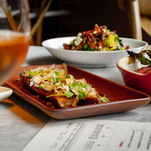 Various plates of food on a table