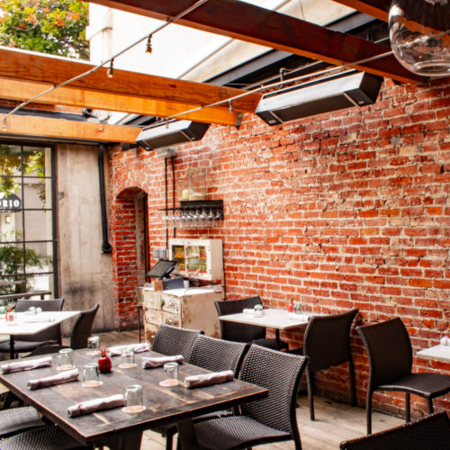 Dining area, brick walls, tables and chairs