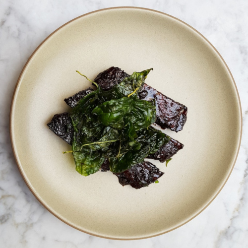 Balsamico glazed ribs with greens, top view