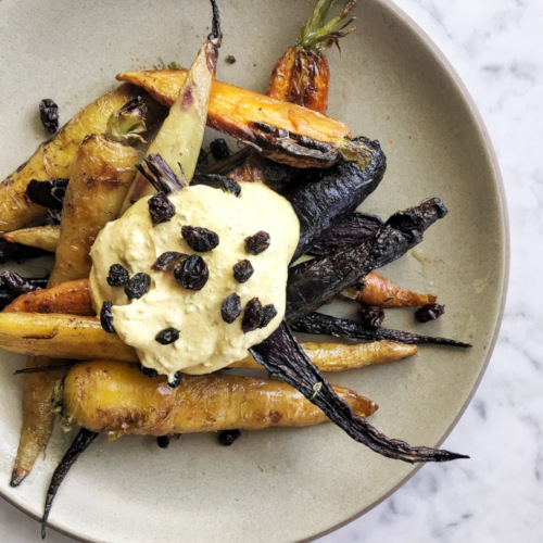 Dish with resins, carrots and cream, top view